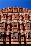 The Hawa Mahal was built in 1799 by Maharaja Sawai Pratap Singh, and designed by Lal Chand Ustad in the form of the crown of Krishna, the Hindu god.<br/><br/>

Jaipur is the capital and largest city of the Indian state of Rajasthan. It was founded on 18 November 1727 by Maharaja Sawai Jai Singh II, the ruler of Amber, after whom the city was named. The city today has a population of 3.1 million. Jaipur is known as the Pink City of India.<br/><br/>

The city is remarkable among pre-modern Indian cities for the width and regularity of its streets which are laid out into six sectors separated by broad streets 34 m (111 ft) wide. The urban quarters are further divided by networks of gridded streets. Five quarters wrap around the east, south, and west sides of a central palace quarter, with a sixth quarter immediately to the east. The Palace quarter encloses the sprawling Hawa Mahal palace complex, formal gardens, and a small lake. Nahargarh Fort, which was the residence of the King Sawai Jai Singh II, crowns the hill in the northwest corner of the old city. The observatory, Jantar Mantar, is a World Heritage Site.