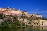 Amer Palace and Fort (Hindi: आमेर क़िला, also spelled and pronounced as Amber) was built by Raja Man Singh I  (December 21, 1550 – July 6, 1614).<br/><br/>

Jaipur is the capital and largest city of the Indian state of Rajasthan. It was founded on 18 November 1727 by Maharaja Sawai Jai Singh II, the ruler of Amber, after whom the city was named. The city today has a population of 3.1 million. Jaipur is known as the Pink City of India.<br/><br/>

The city is remarkable among pre-modern Indian cities for the width and regularity of its streets which are laid out into six sectors separated by broad streets 34 m (111 ft) wide. The urban quarters are further divided by networks of gridded streets. Five quarters wrap around the east, south, and west sides of a central palace quarter, with a sixth quarter immediately to the east. The Palace quarter encloses the sprawling Hawa Mahal palace complex, formal gardens, and a small lake. Nahargarh Fort, which was the residence of the King Sawai Jai Singh II, crowns the hill in the northwest corner of the old city. The observatory, Jantar Mantar, is a World Heritage Site.